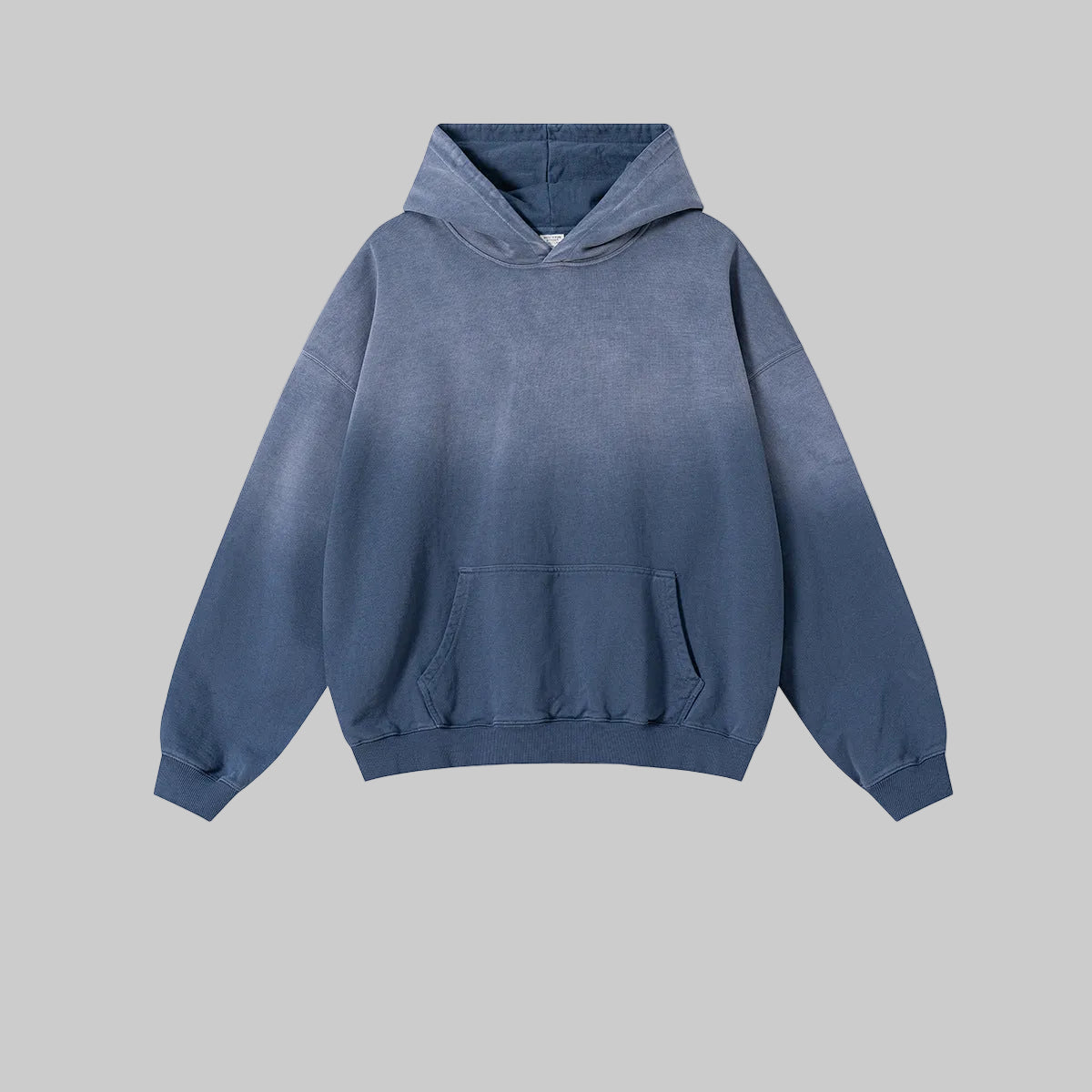 Distressed heavyweight hoodie in faded indigo blue with kangaroo pocket and hood