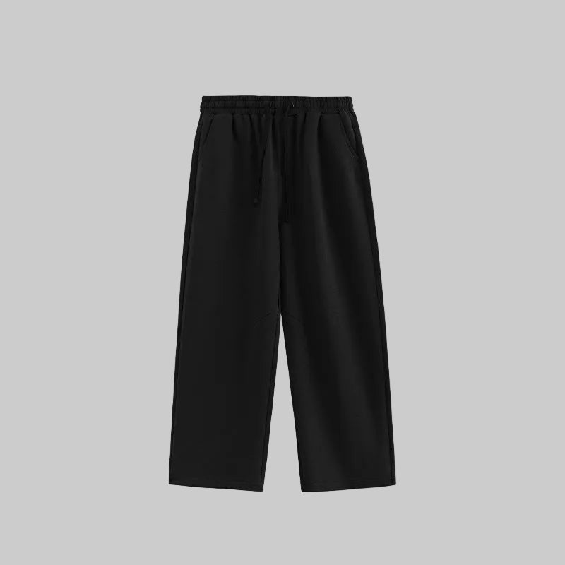 Relaxed wide-leg trousers in black, elastic waistband with drawstring