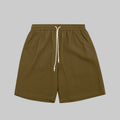 Waffle lounge shorts in moss green, elastic waistband with white drawstring, relaxed fit.