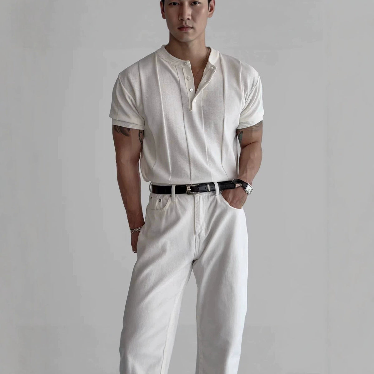 Ecru knit henley tee with three-button placket and short sleeves