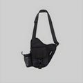 Black sling backpack with adjustable strap, front zip pocket and small side pouch