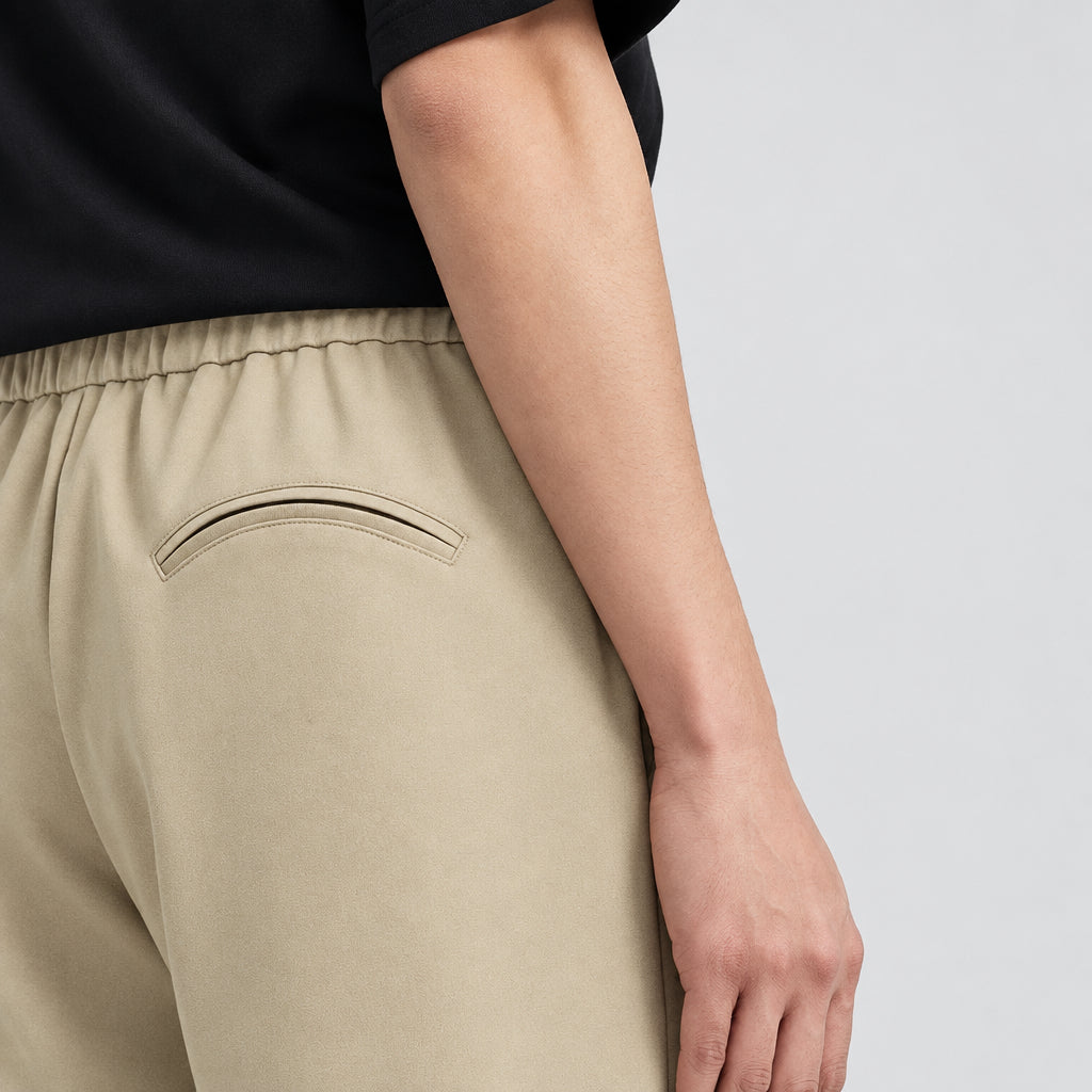 Walnut wide-leg suit trousers close-up of elastic waistband and front pocket seam