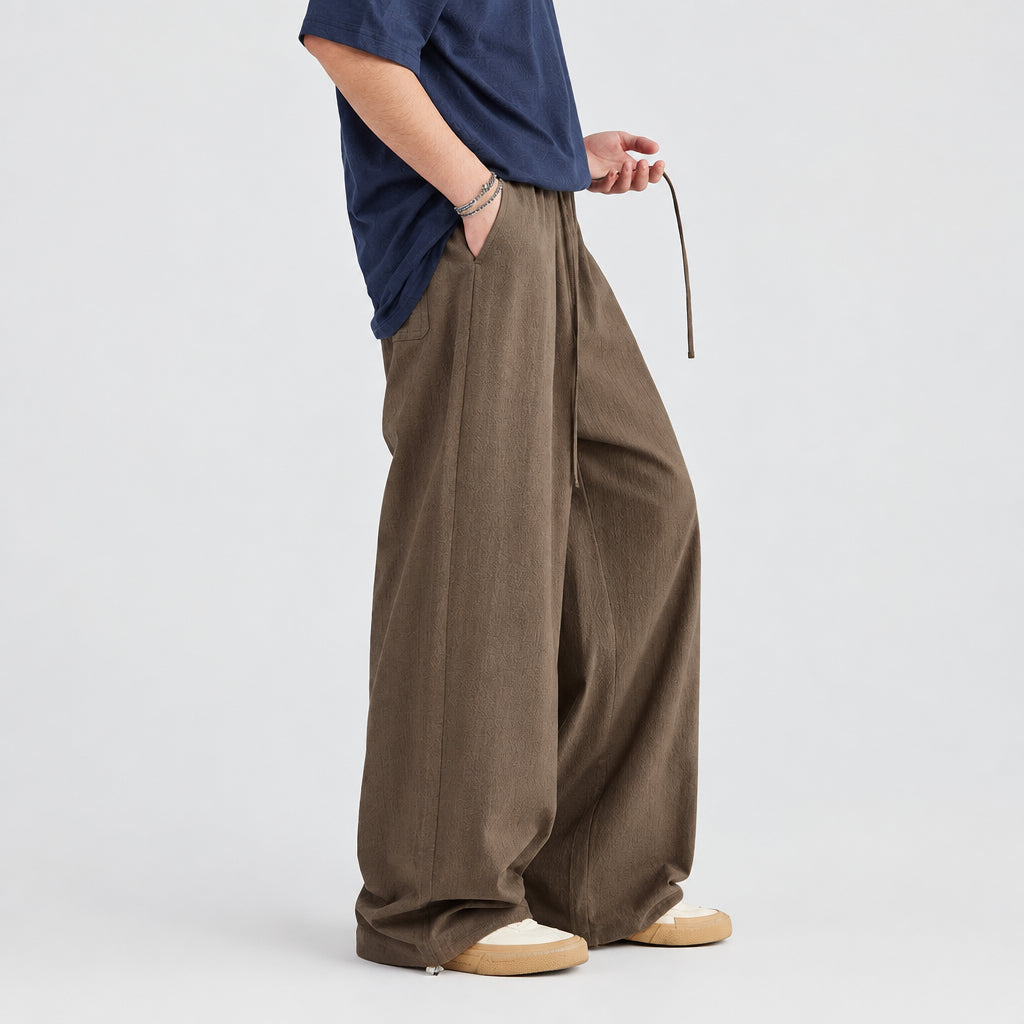 Linen-blend wide-leg trousers in walnut brown with elastic waist and drawstring pockets