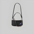 Mini black shoulder bag with dual top handles and front zip pocket, chain strap detail