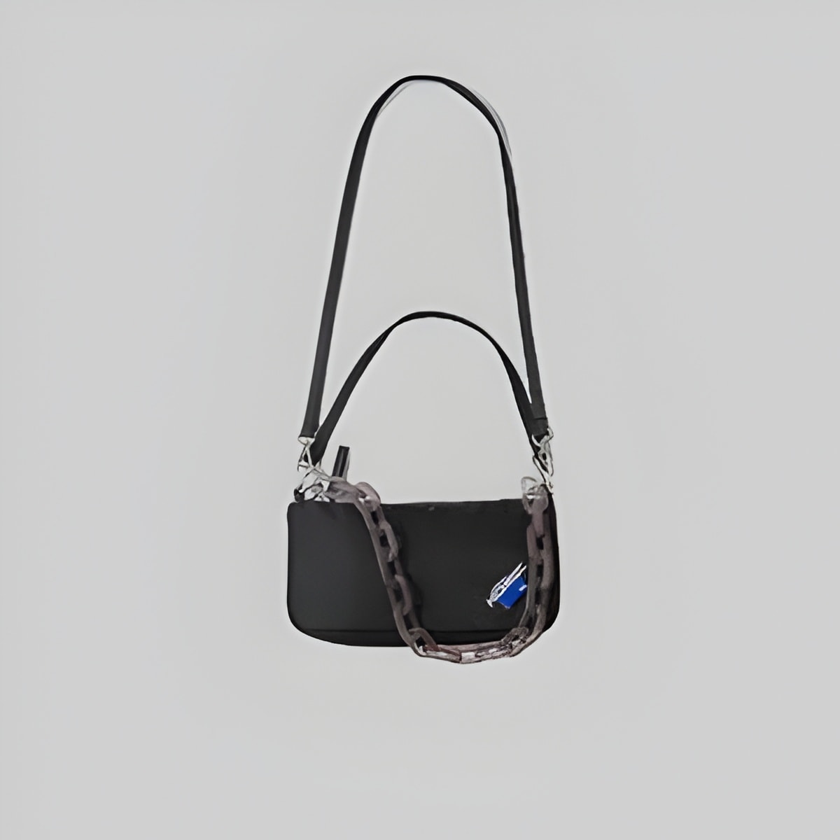 Mini black shoulder bag with dual top handles and front zip pocket, chain strap detail