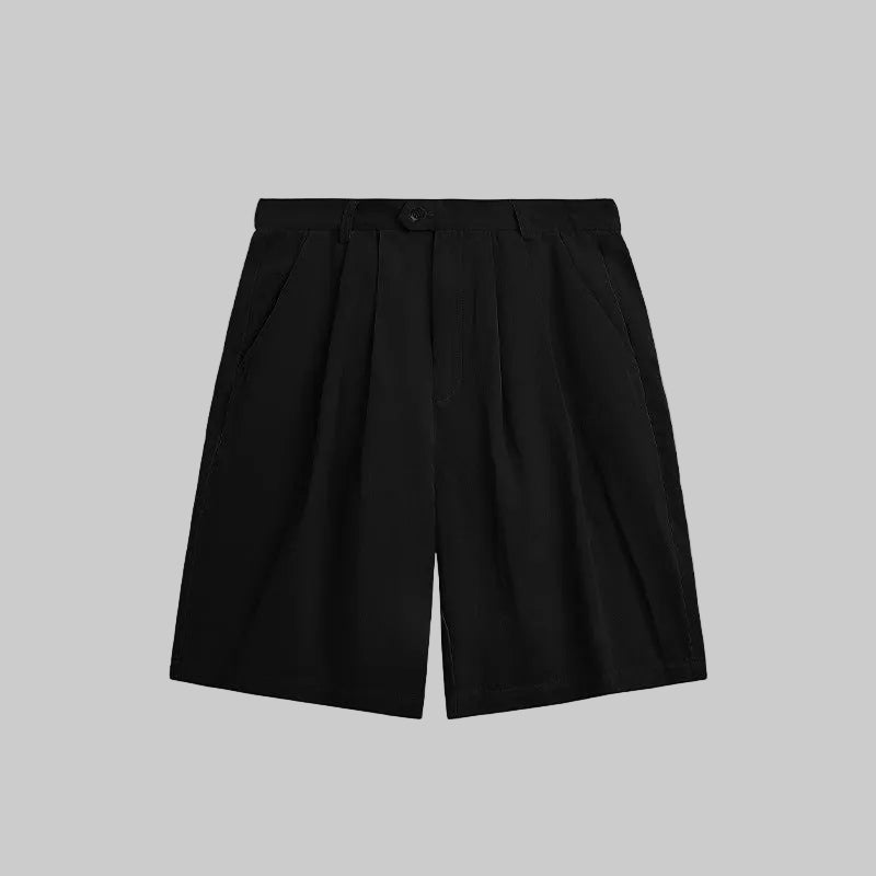 Obsidian pleated suit shorts with front pleats, belt loops, and button closure