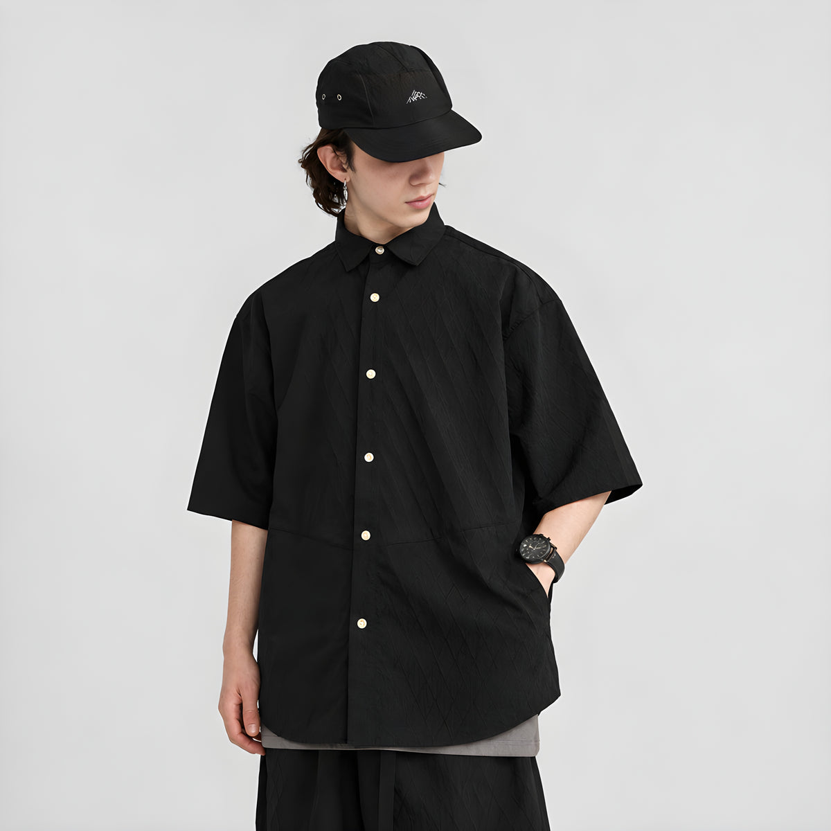 Black jacquard short-sleeve button-up shirt with point collar and visible front placket