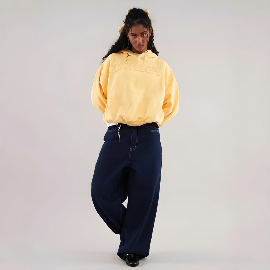 Ochre pullover hoodie with hood and front pocket, embossed lettermark logo