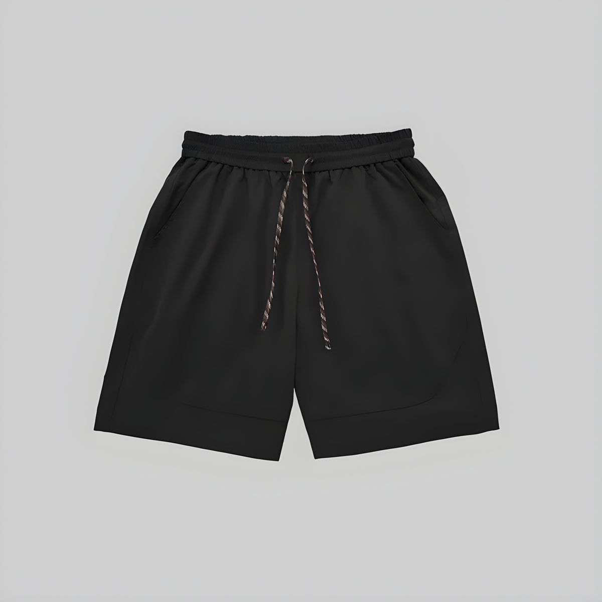 Black technical training shorts with elastic waistband, drawstring, and side pockets.