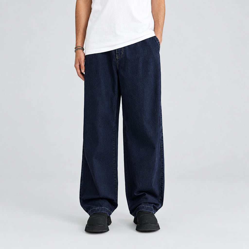 Washed bamboo trousers in dark denim, wide-leg fit with stitched cuffs.