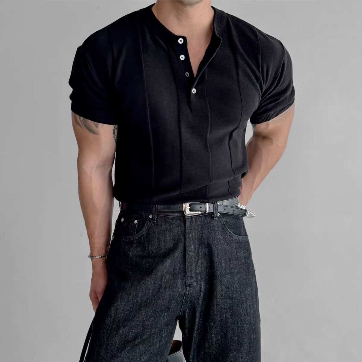 Black knit henley shirt with stand collar and three snap buttons