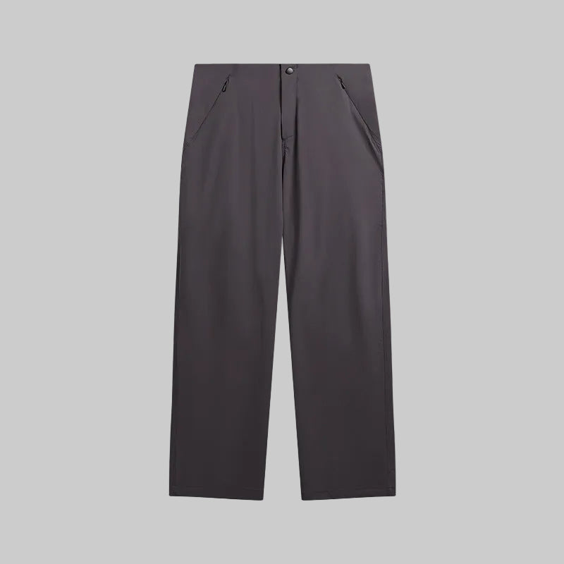 Dark charcoal technical hiking trousers with button waist and relaxed straight legs