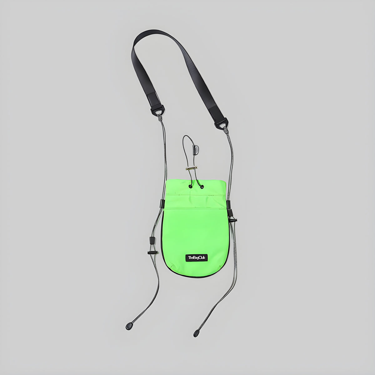 Neon green mini drawcord pouch with black adjustable crossbody straps and drawstring top.