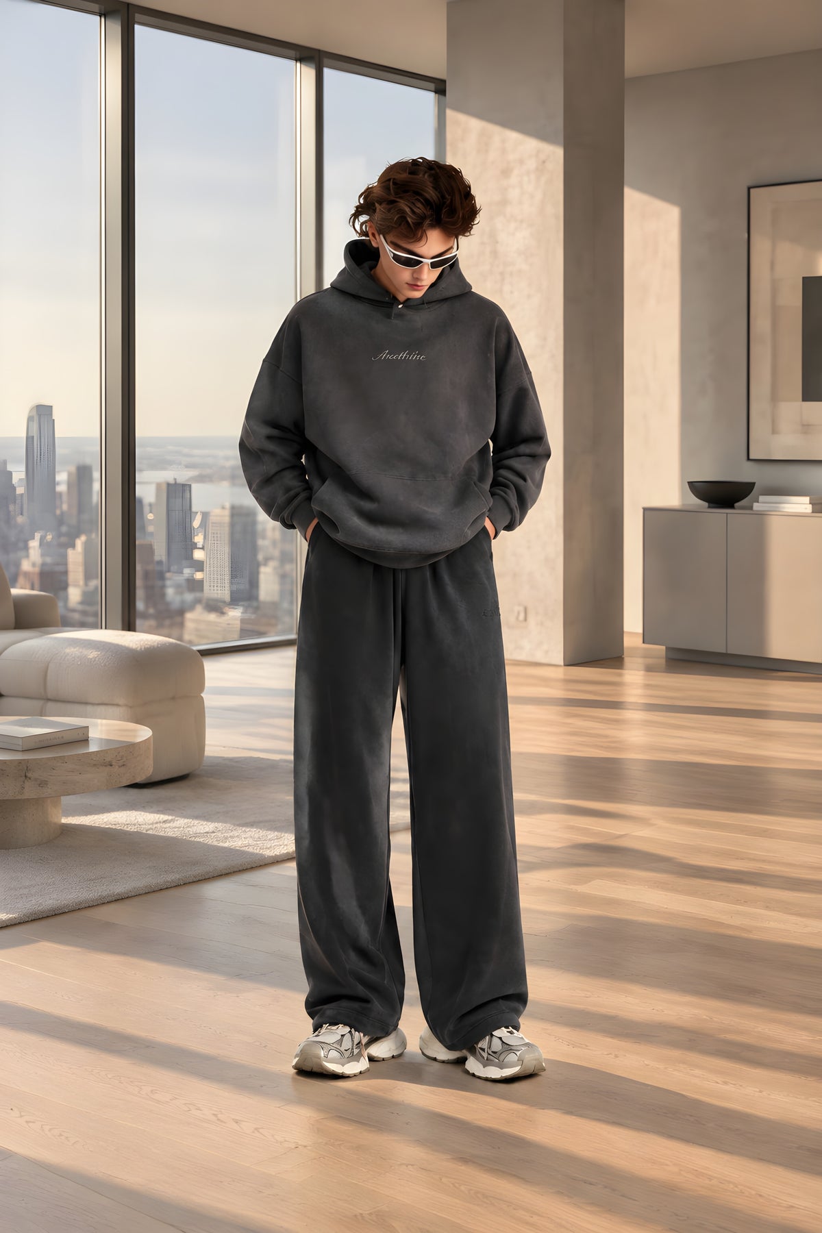 Graphite wide-leg brushed trousers on model, elastic waistband, side pockets, drawstring