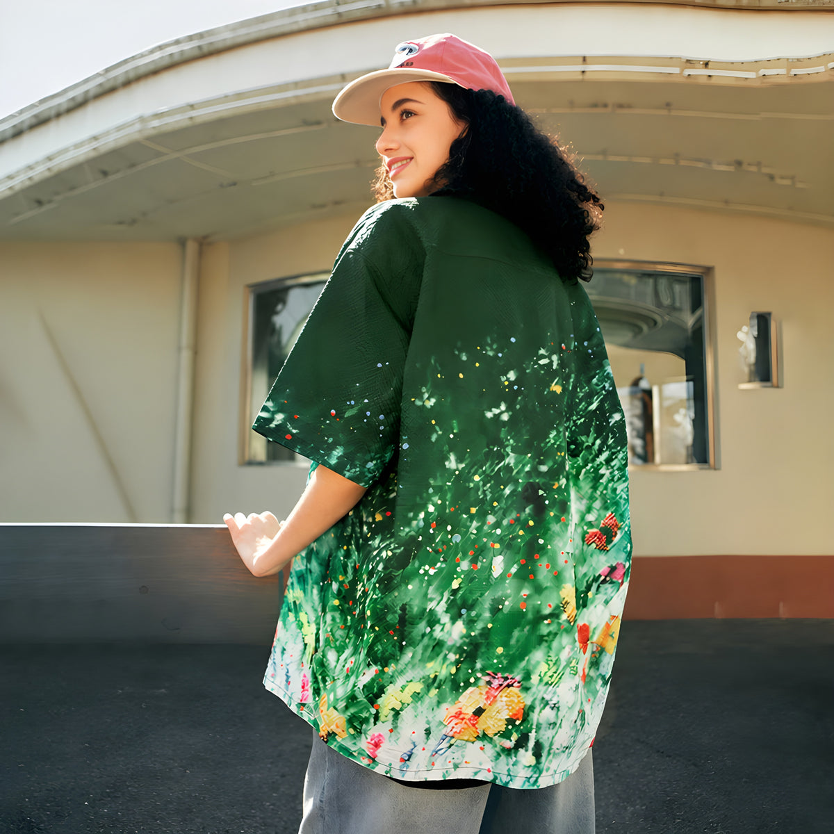 Green gradient floral short-sleeve button-up shirt with camp collar, worn from the back