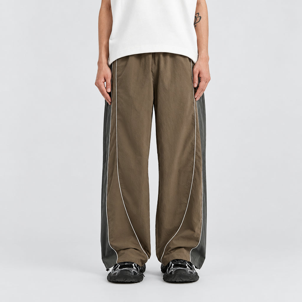 Walnut reflective stripe trousers with vertical reflective stripes along wide legs