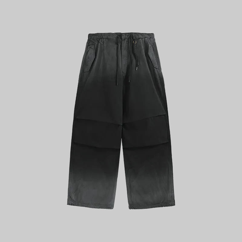 Obsidian washed utility trousers, drawstring waist, cargo pockets, wide leg.