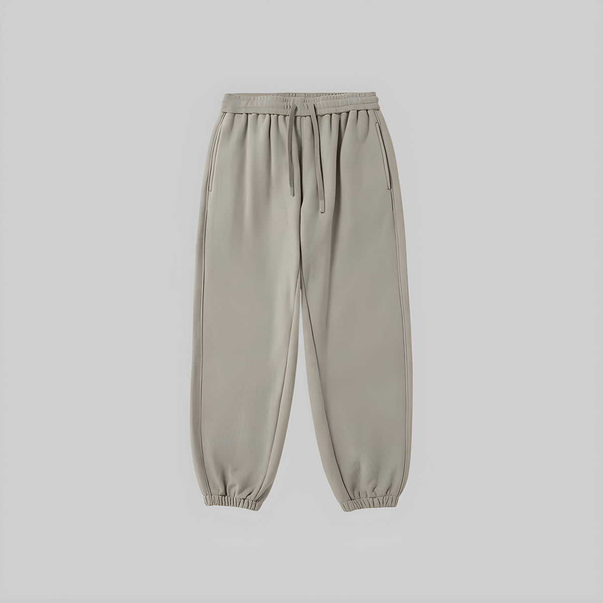 Brushed relaxed sweatpants in light beige, elastic waistband with drawstring, cuffed hems