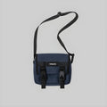 Navy crossbody messenger bag with front flap and adjustable shoulder strap