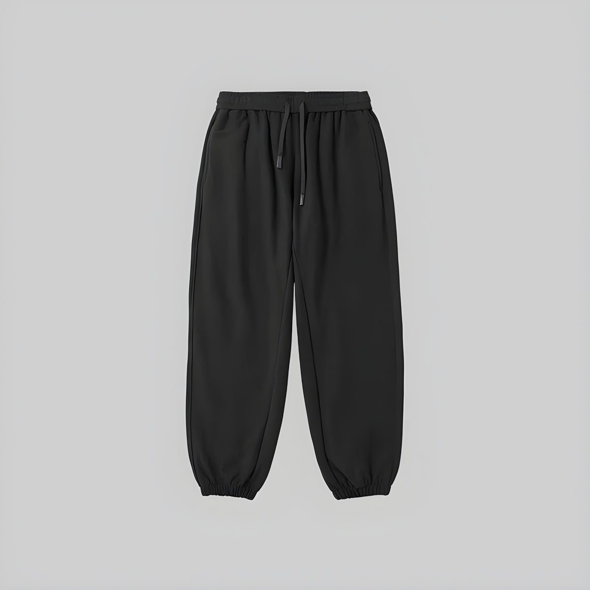 Brushed relaxed sweatpants in black, elastic waistband with drawstring, cuffed ankle hems