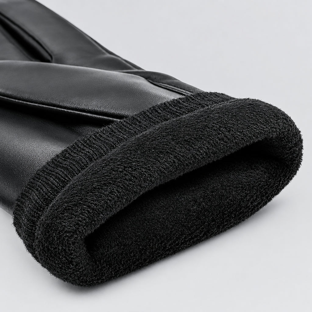 Shearling-lined cuff on a black leather glove with soft textured edge