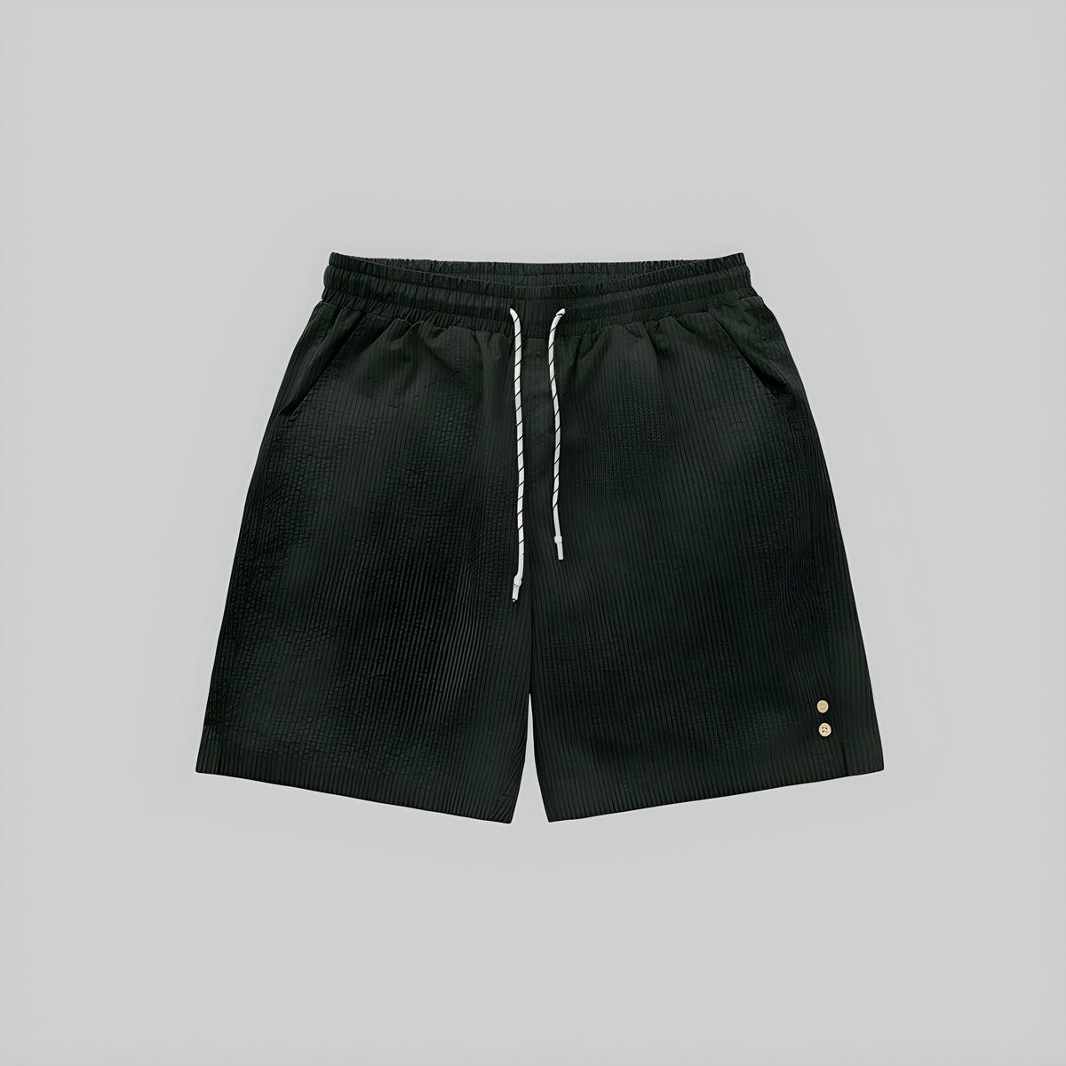 Dark green seersucker shorts with elastic waistband and drawstring; side eyelet details