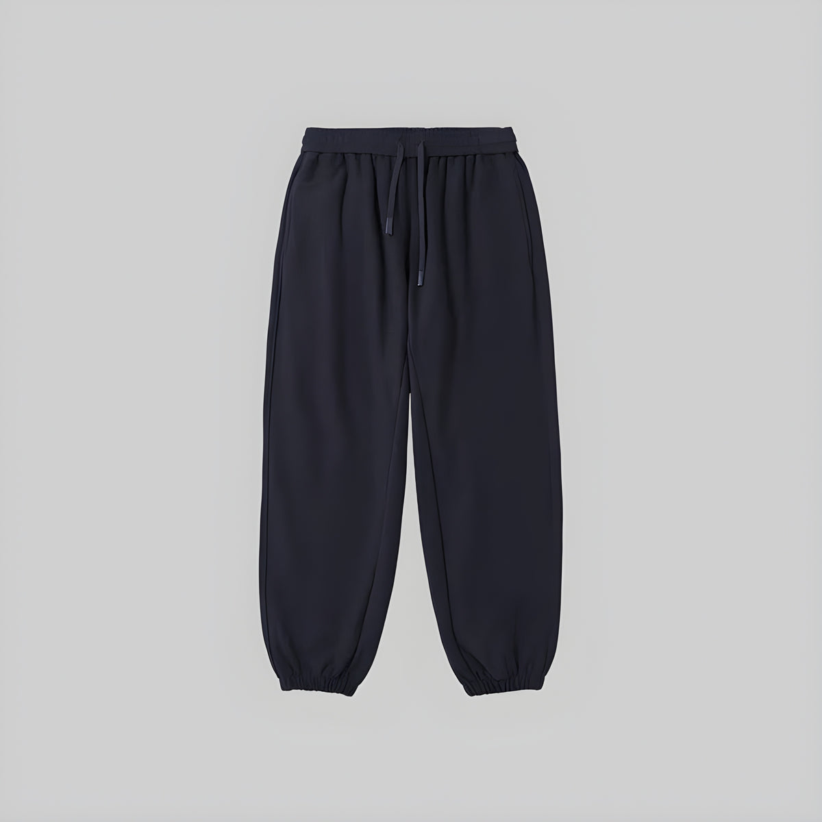 Brushed relaxed sweatpants in dark navy, elastic waistband with drawstring, cuffed hems