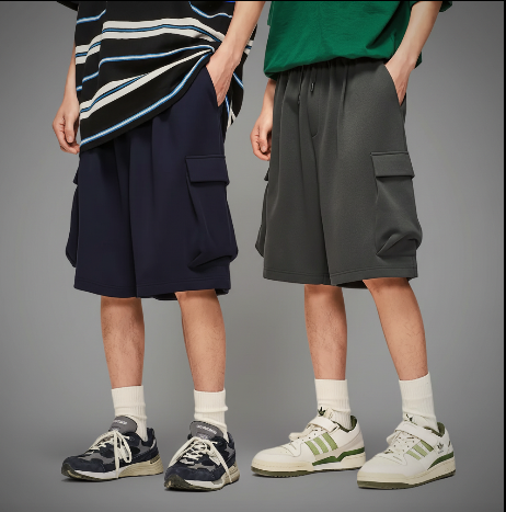 Pair of modular capacity cargo shorts in dark navy and charcoal, drawstring waist, side pockets
