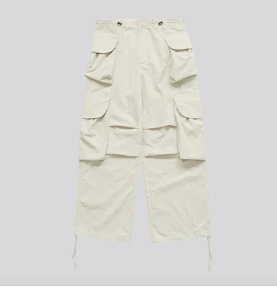 Ivory wide-leg cargo trousers front view with layered flap pockets and tie-cord hem tabs