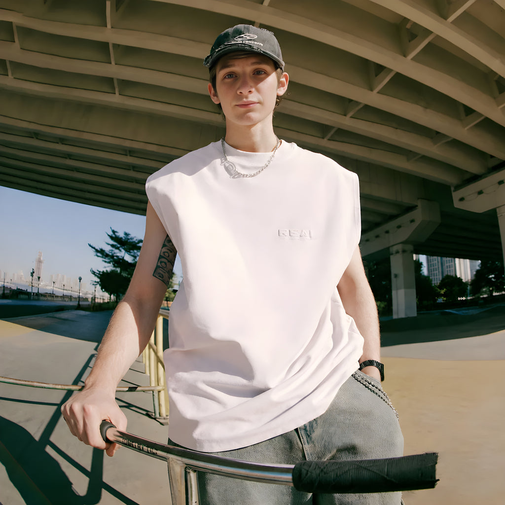 White sleeveless crew-neck vest with small flocked chest logo