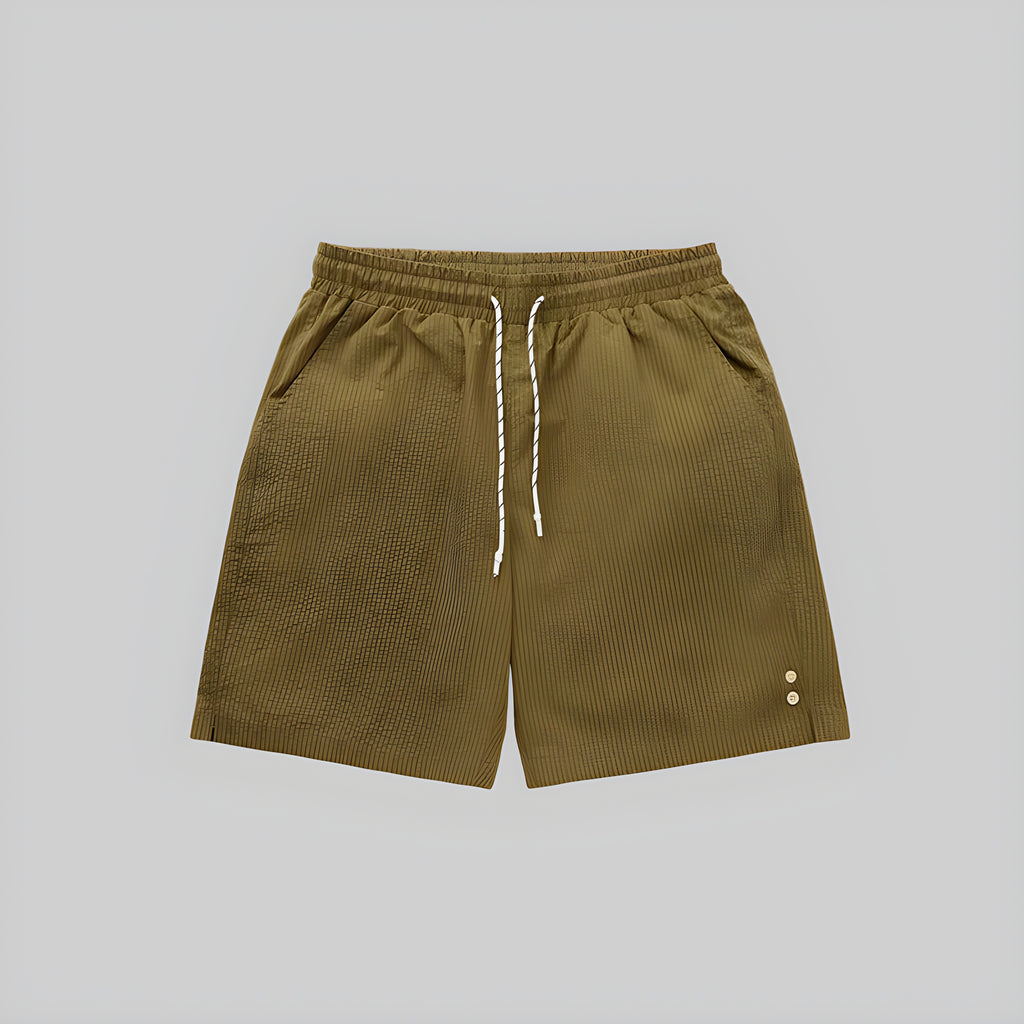 Khaki seersucker shorts with elastic waistband and white drawstring; side eyelet accents