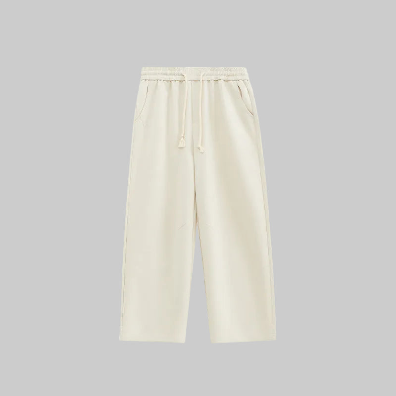 Relaxed wide-leg trousers in light apricot, elastic waistband with drawstring