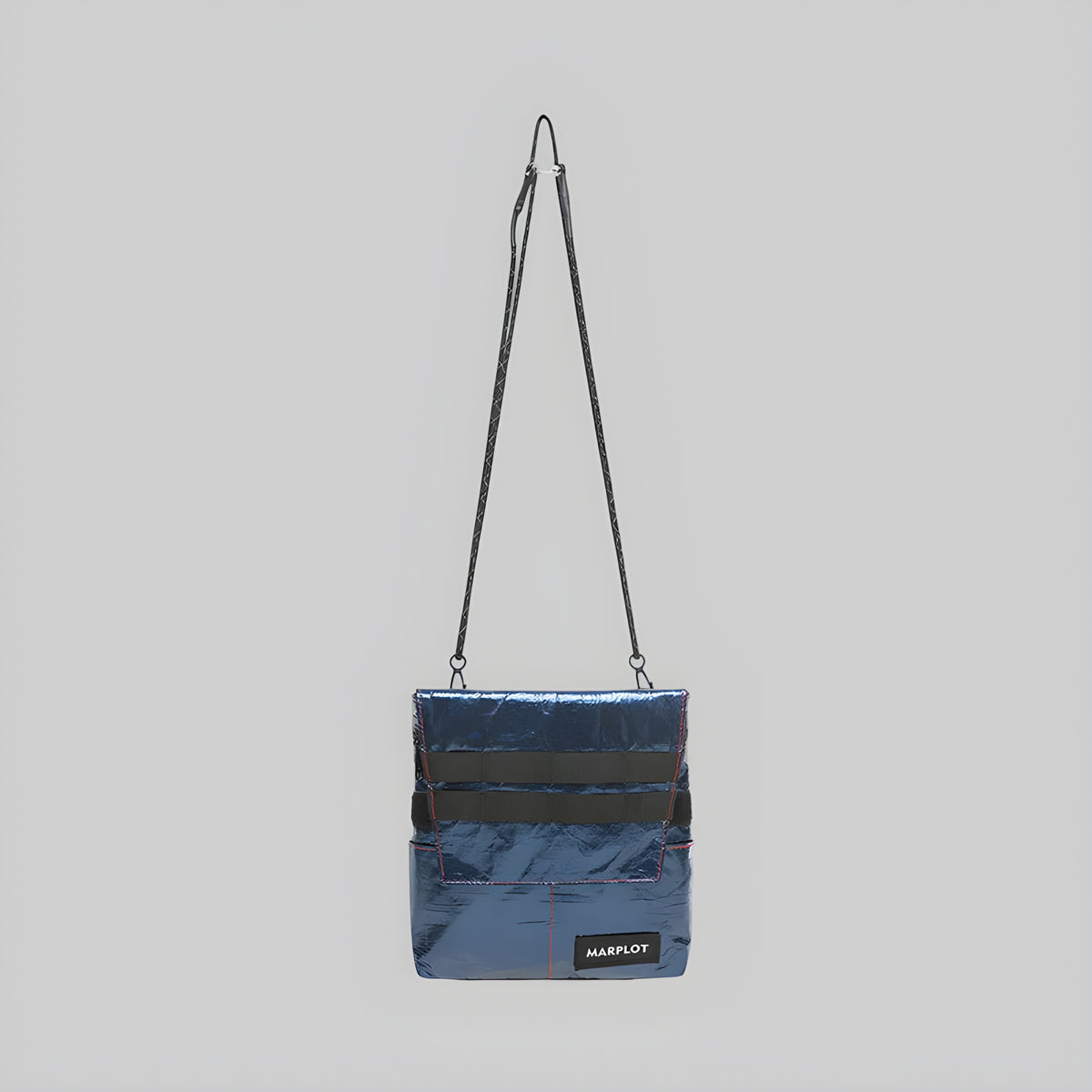 Dark denim navy foldover crossbody bag with long shoulder strap and front flap