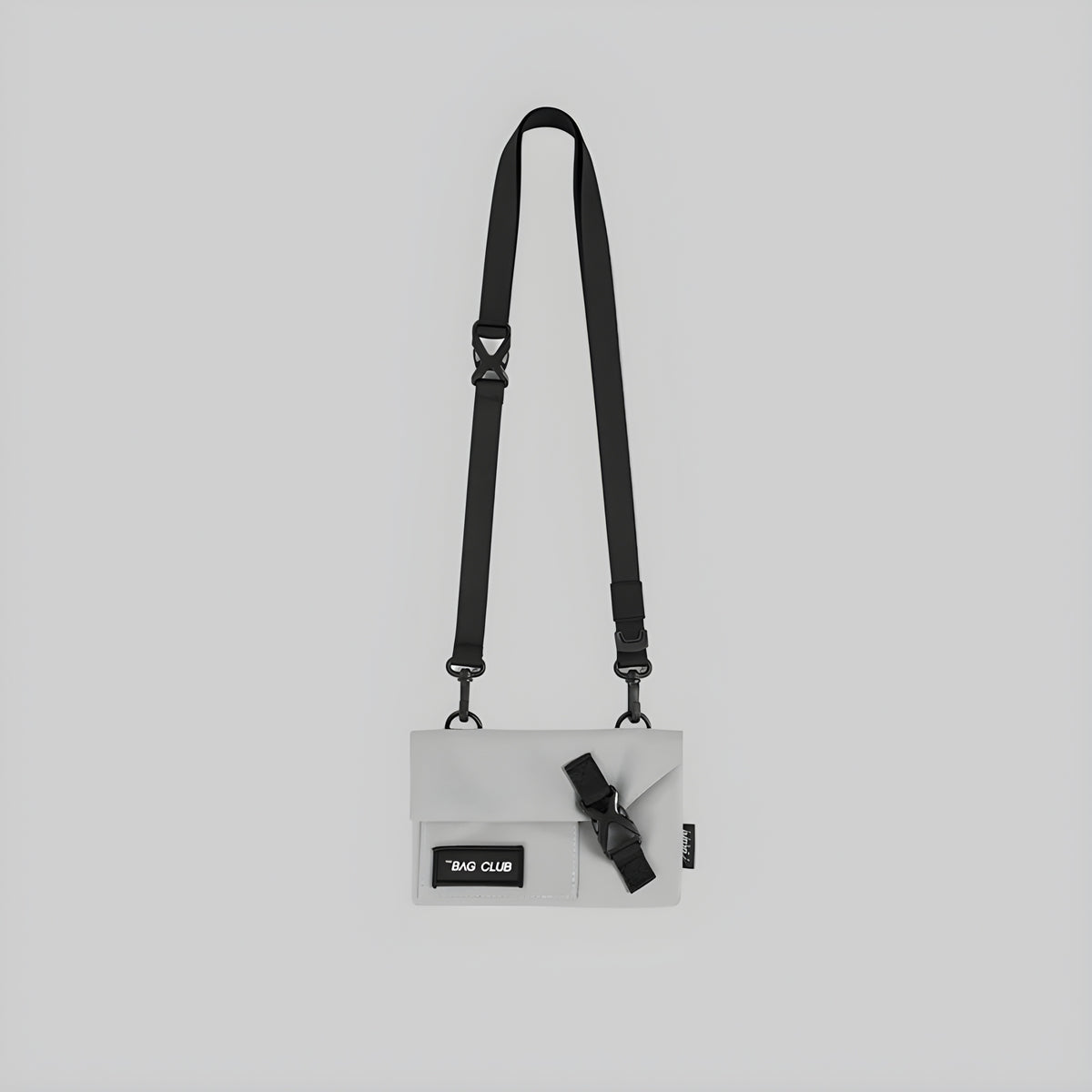Slim crossbody bag with adjustable shoulder straps, light grey body, front patch pocket