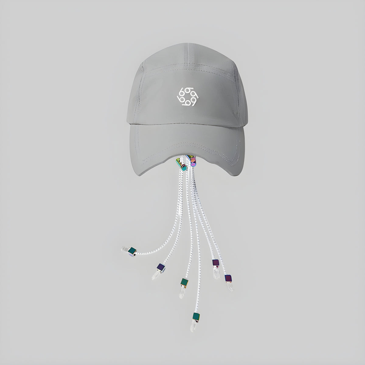 Light gray photochromic cap with front logo and dangling white cords with multicolor tips