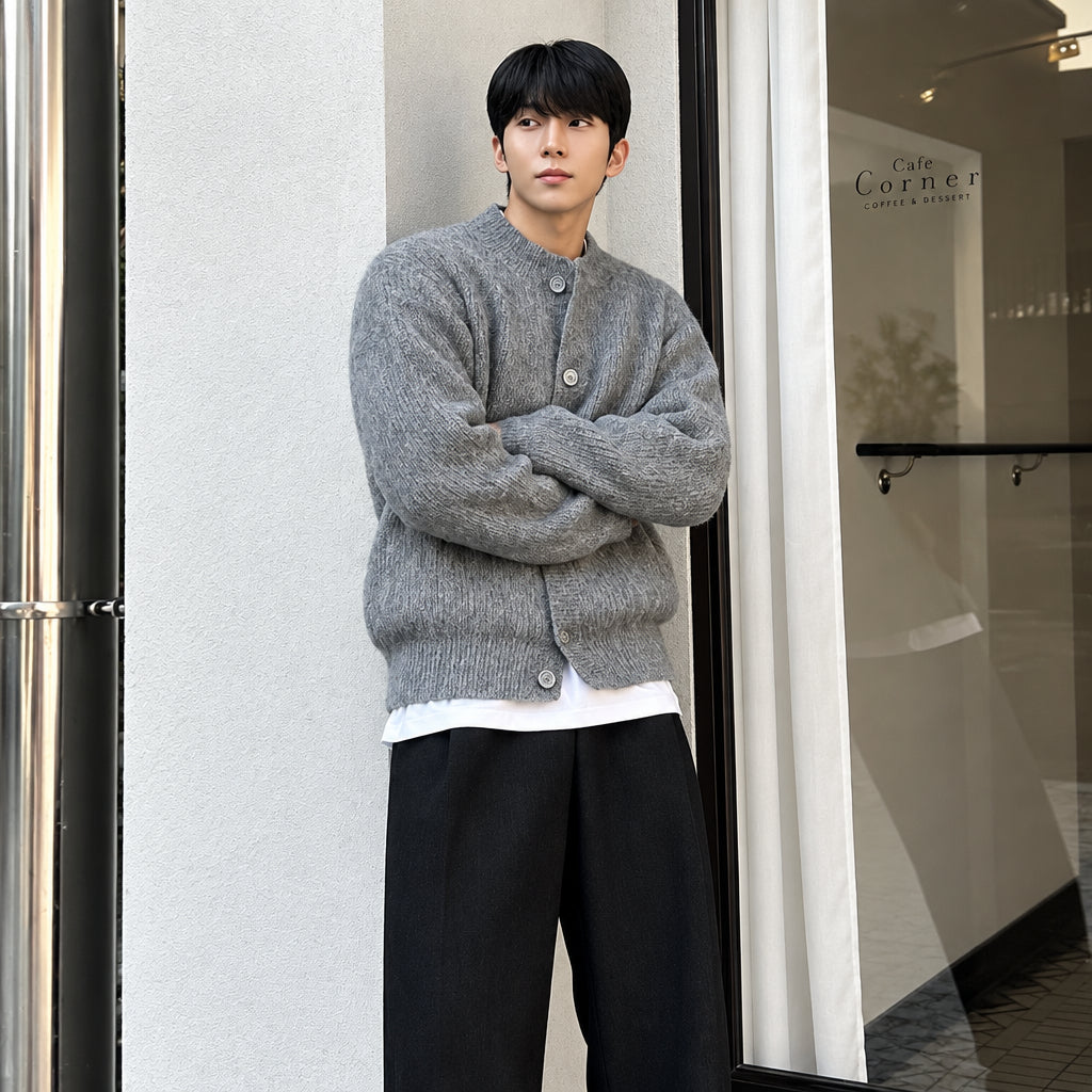 Ash textured merino cardigan with button front and ribbed cuffs, model front view