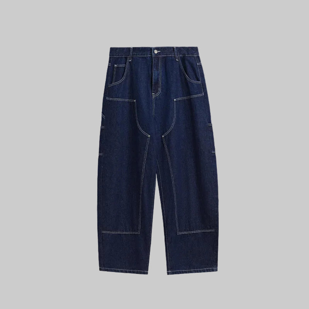 Wide-leg jeans in indigo denim with contrast stitching and patch pockets