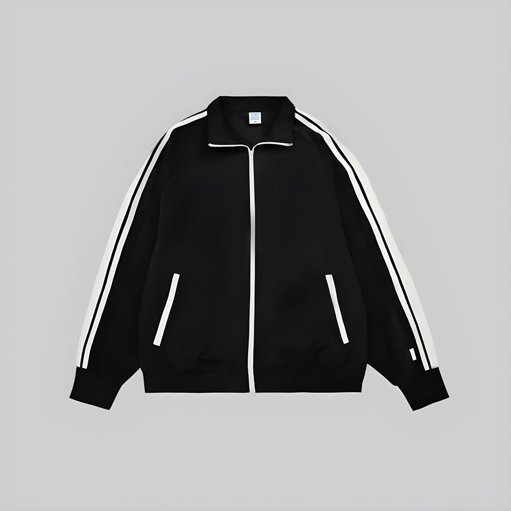 Black zip-up jacket with white contrast stripes and zipper, ribbed cuffs and hem