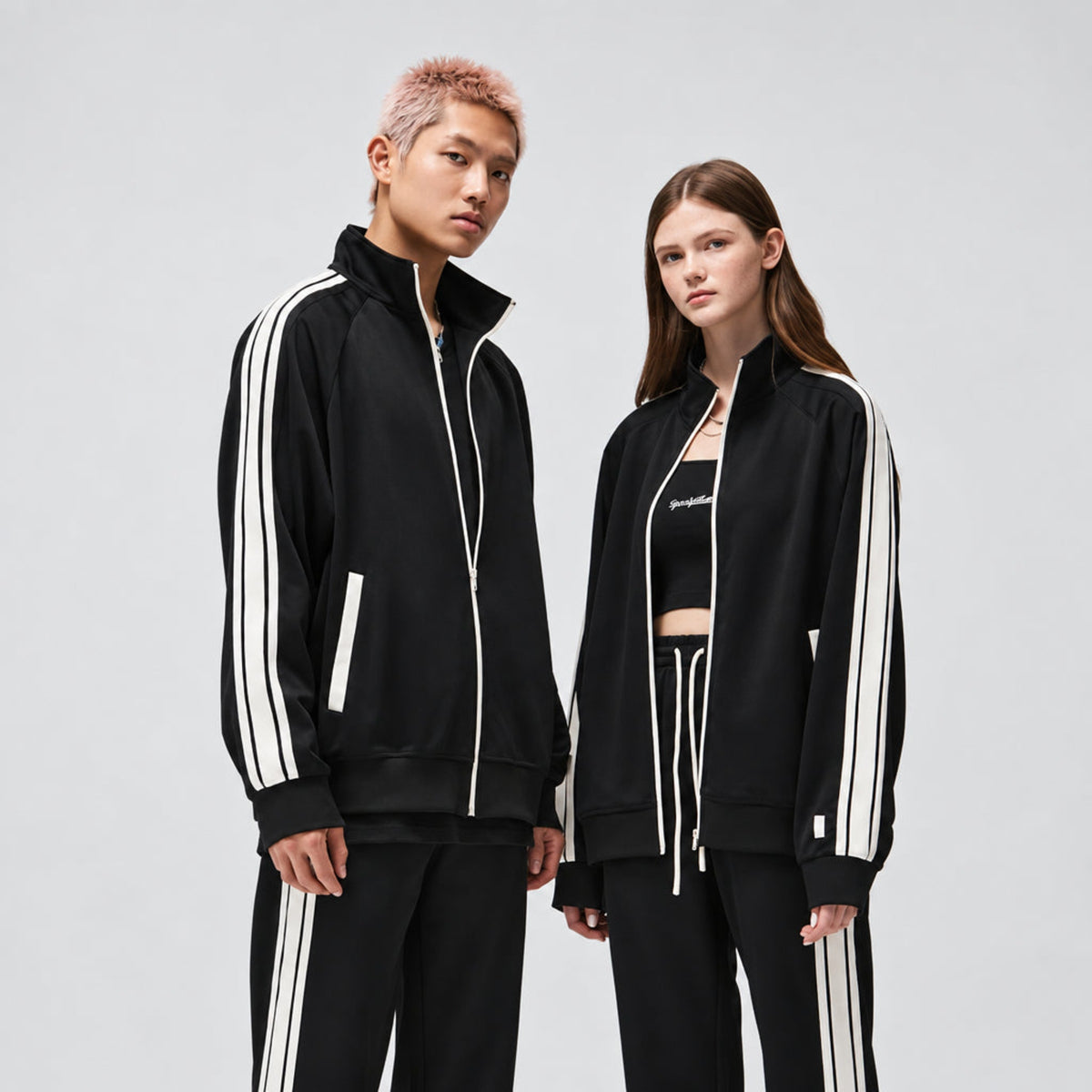 Black zip-up track jacket with white sleeve stripes and contrast zipper, ribbed cuffs