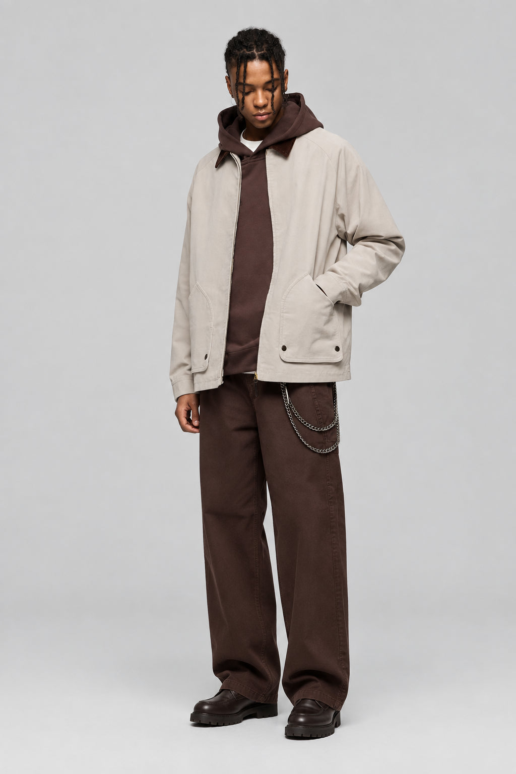 Beige corduroy-collar jacket with full zip and flap pockets, worn by model