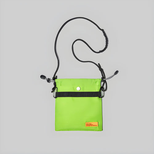 Small neon lime crossbody bag with adjustable strap and front snap button pocket