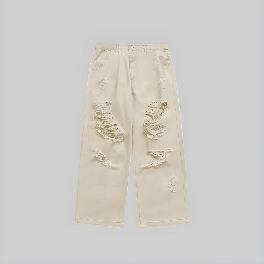 Ecru wide-leg jeans with distressed knee rips and frayed patches