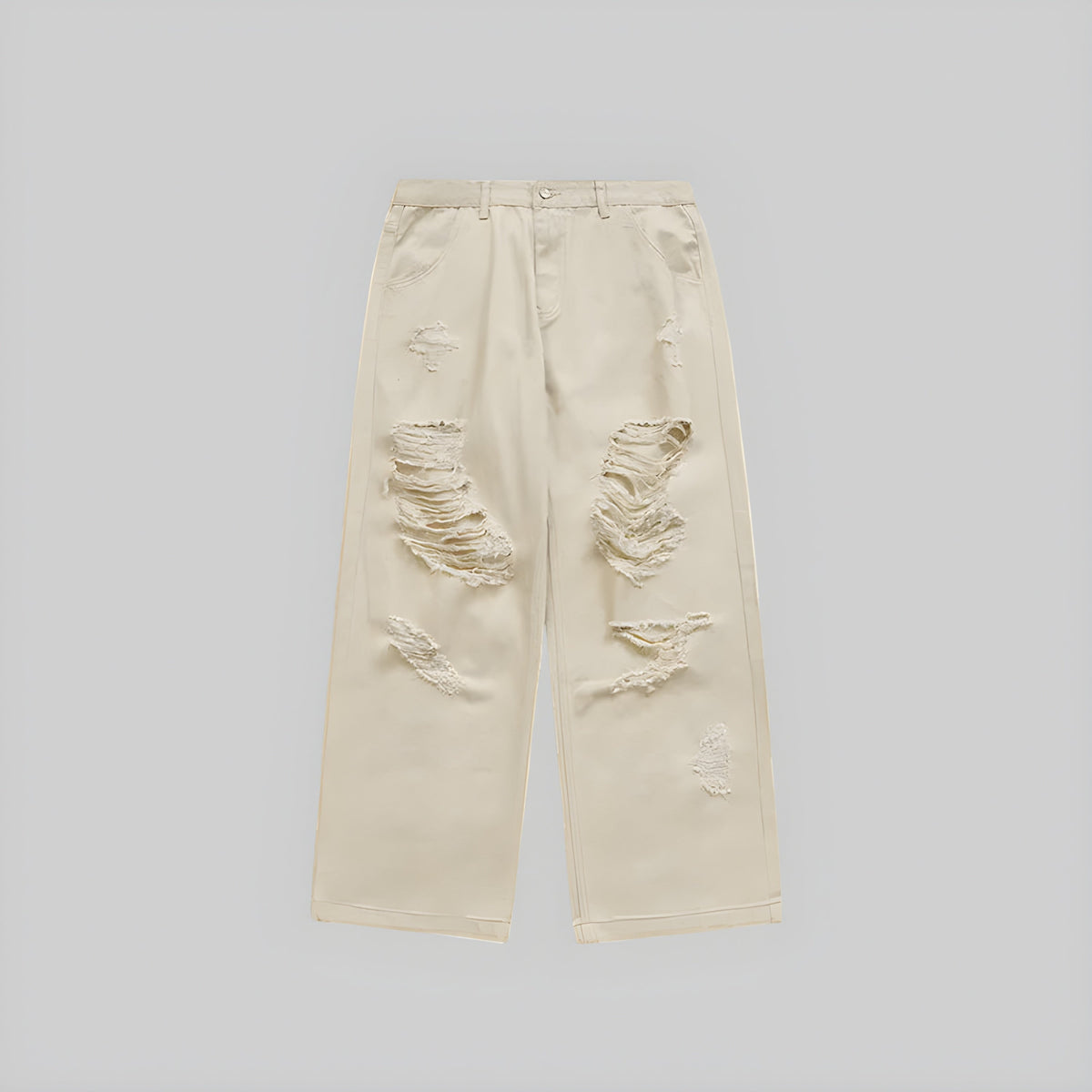 Ecru wide-leg jeans with distressed knee rips and frayed patches