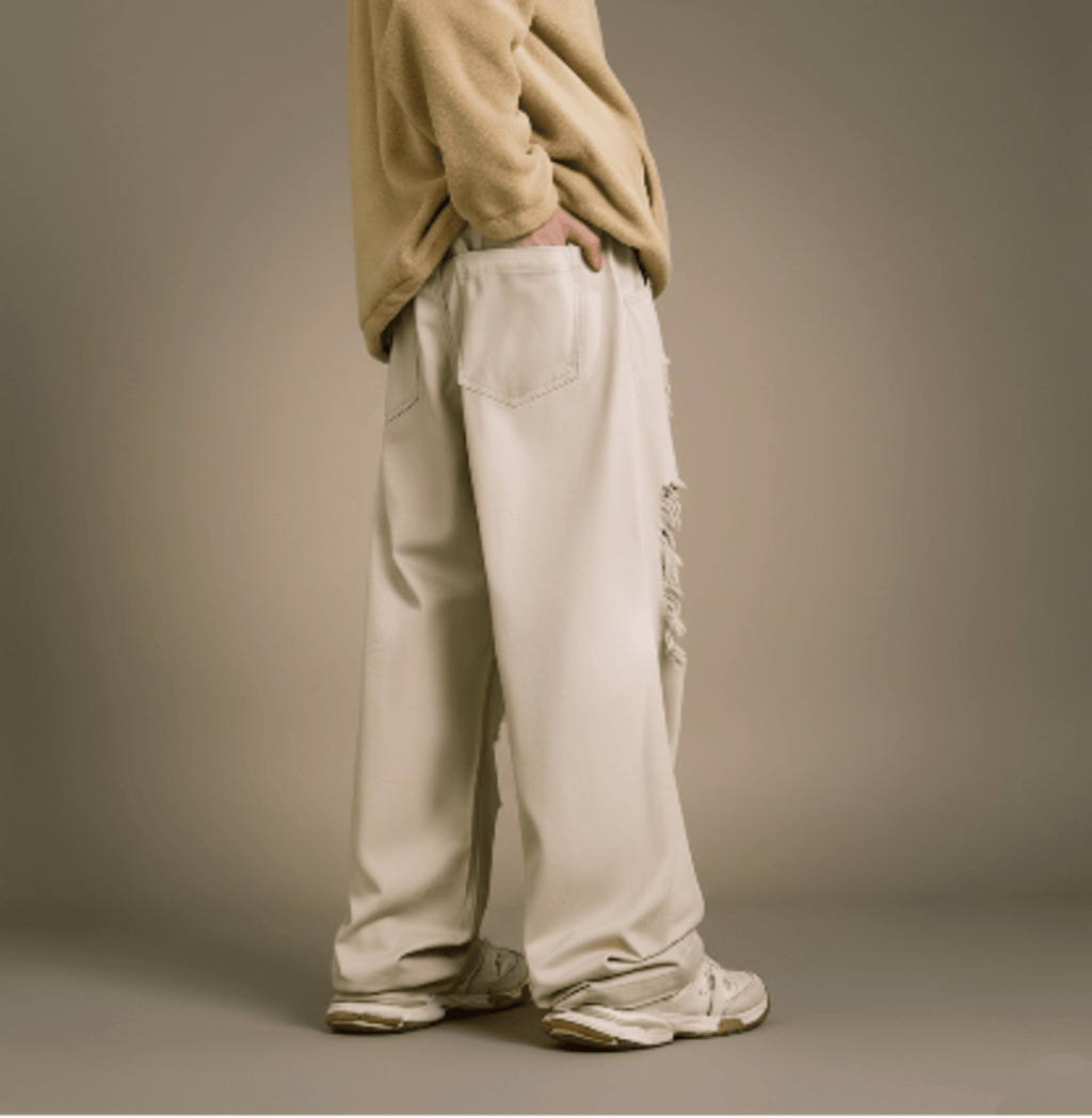 Ecru wide-leg jeans, back view with buttoned back pockets and distressed rips