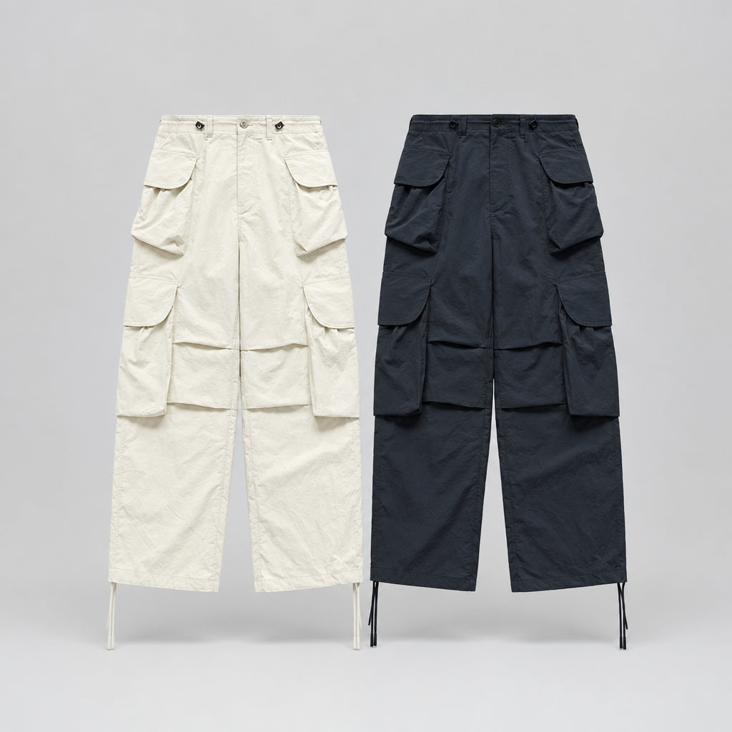 Wide-leg cargo trousers in ivory and indigo, front views with stacked flap cargo pockets