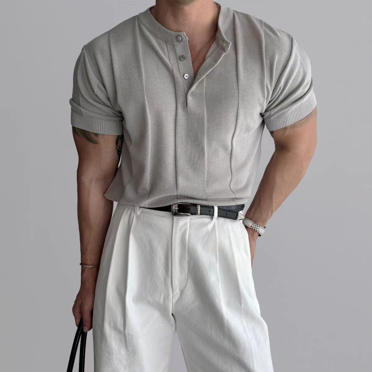 Light gray knit henley tee with three-button placket and ribbed cuffs