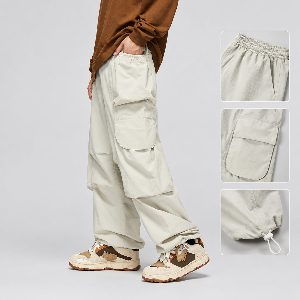 Ivory wide-leg cargo trousers with drawstring-style waist, cargo pockets, and ankle hem