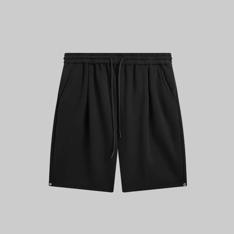 Relaxed utility shorts in black with elastic waistband and drawstring tie