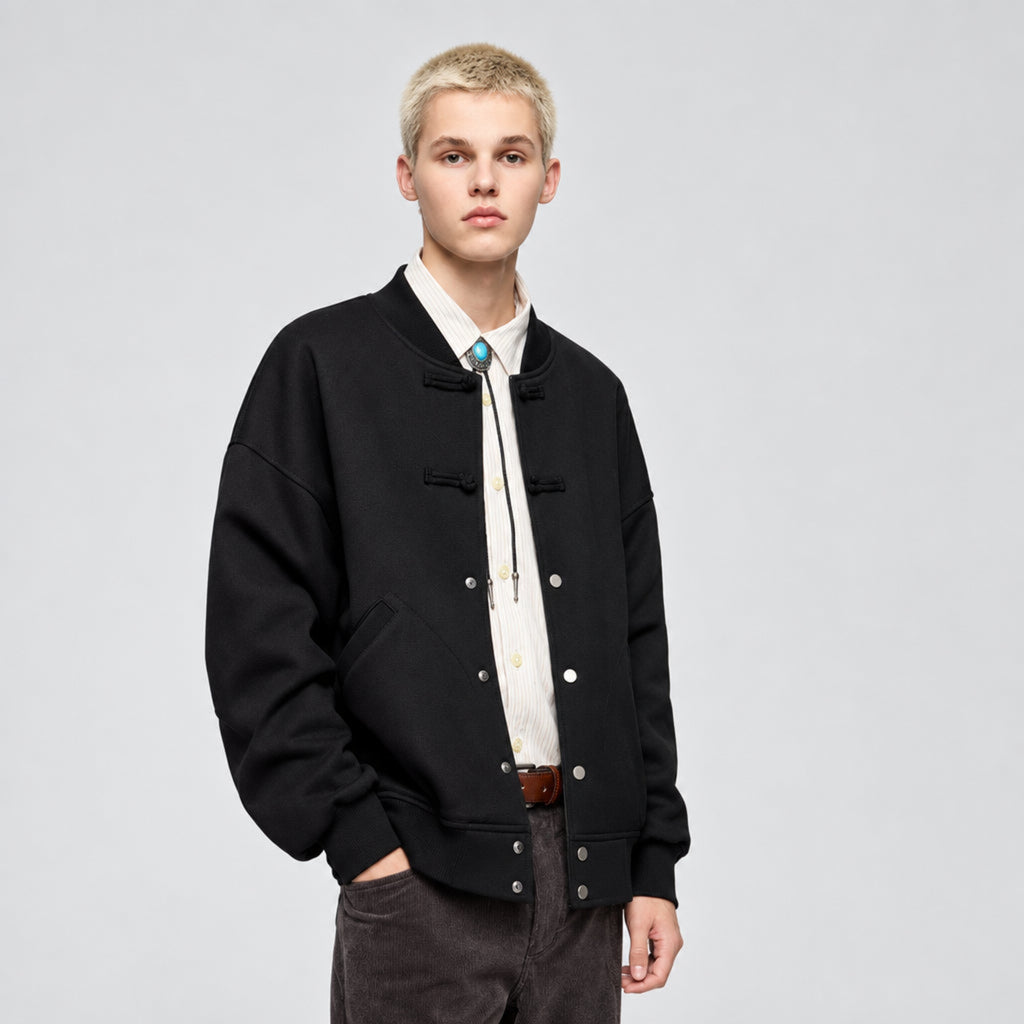 Obsidian black fleece baseball jacket with snap-button front and two chest pockets