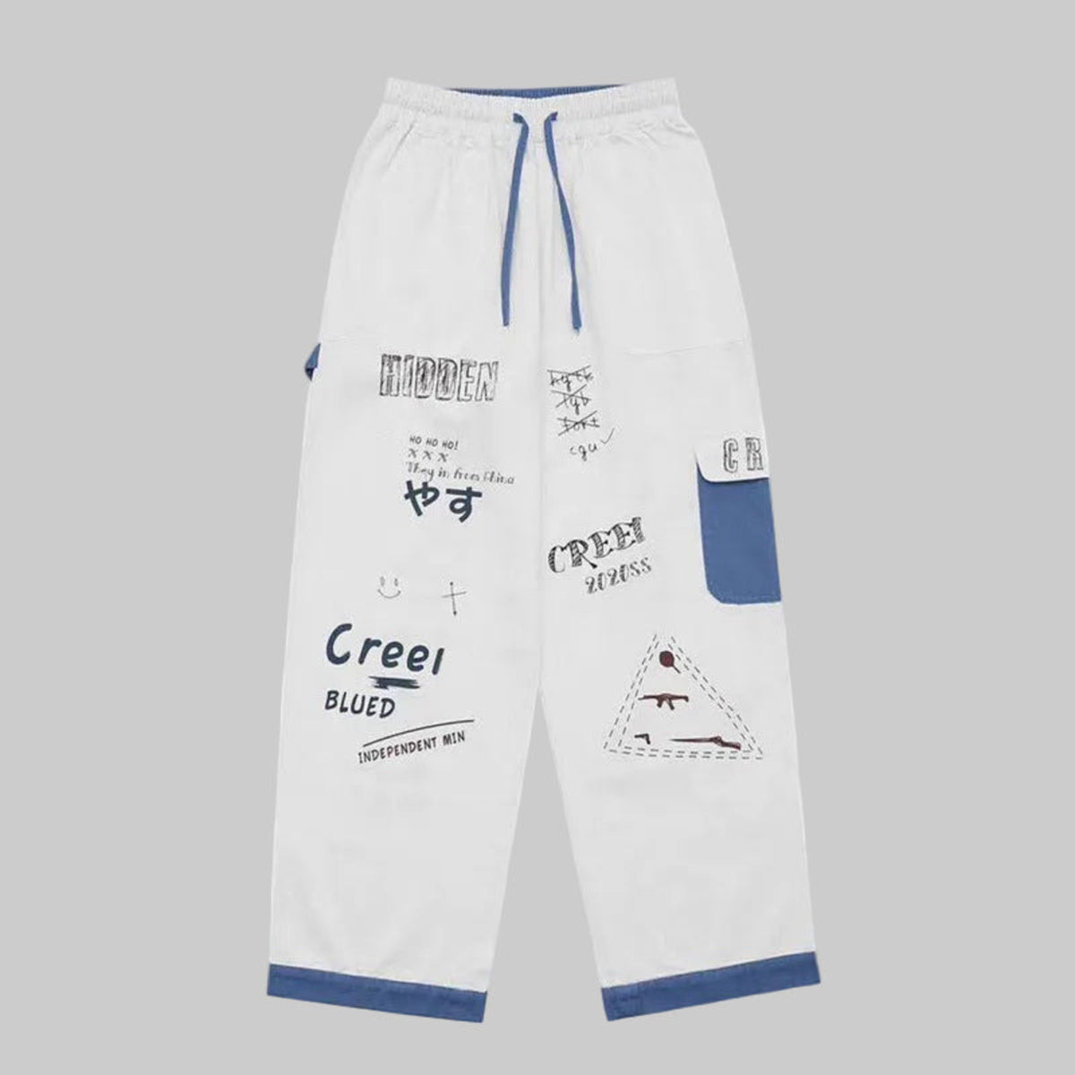 Ivory graffiti washed jeans with blue-trim cuffs and patch pockets, drawstring waist